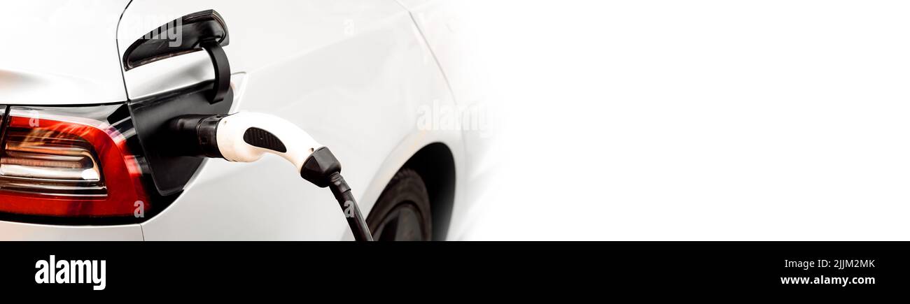 Electric car at the charging station background with free space in blue ...