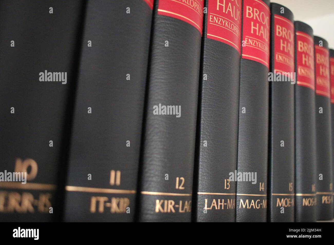 A closeup shot of a many volumes of black Brockhaus encyclopedia Stock Photo