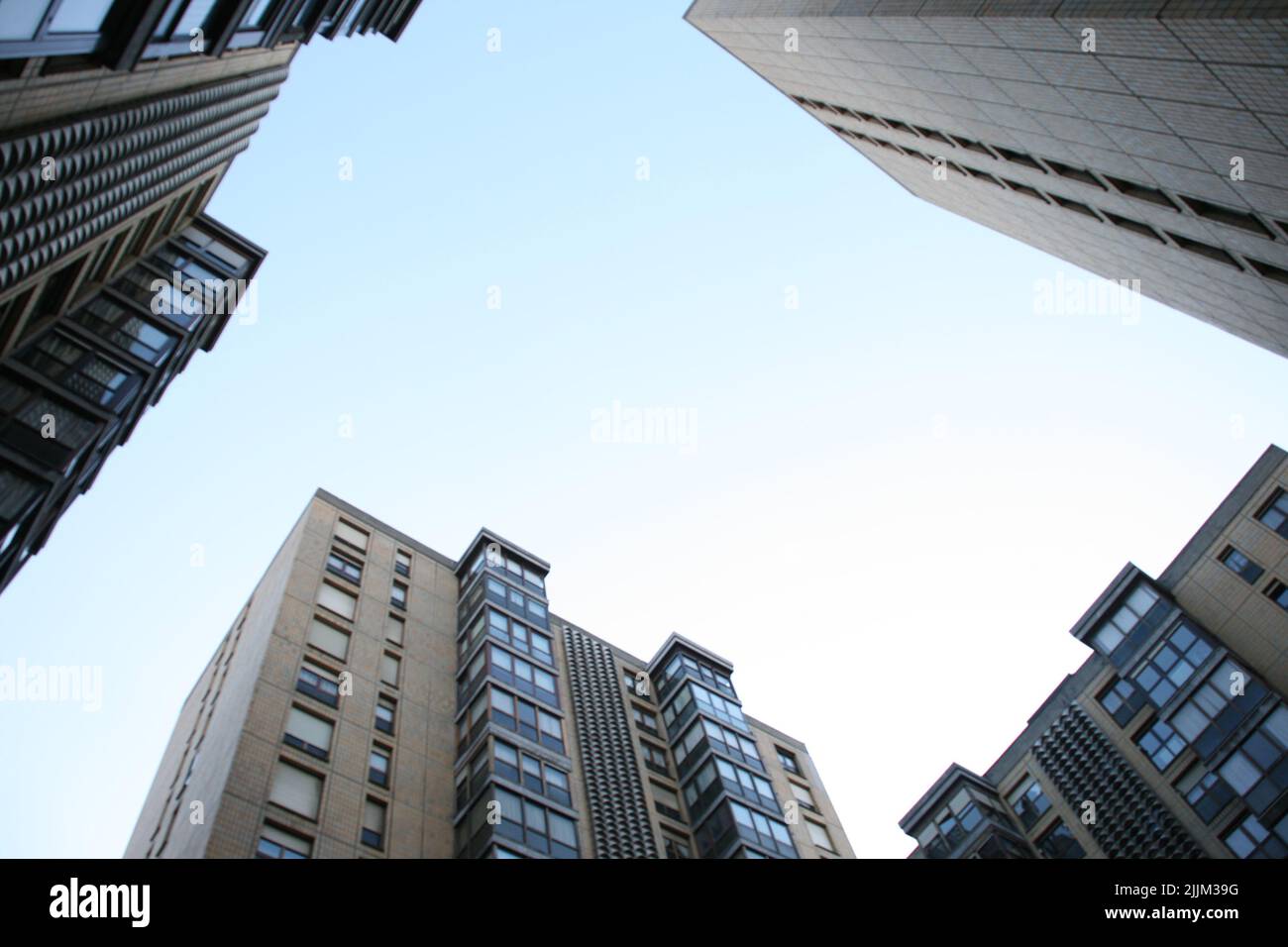 A low angle shot of modern building under the clear skies Stock Photo ...