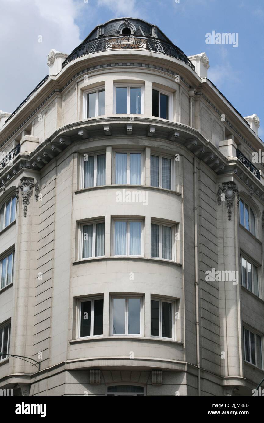 A vertical shot of a facade of modern apartment building Stock Photo ...