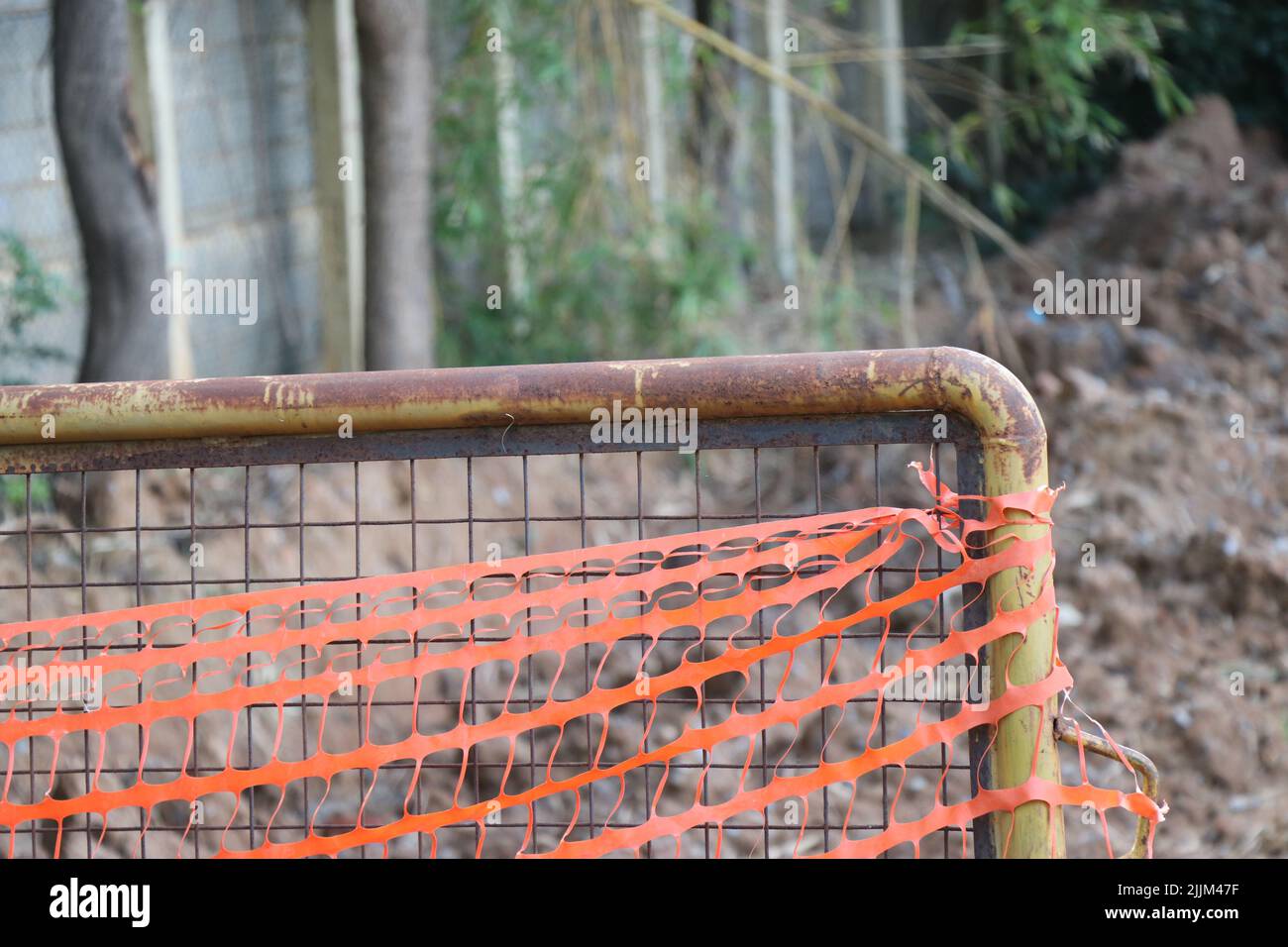 Construction barriers or Roadblock barriers are made of metal with a side part view and some plastic ribbons tie Stock Photo