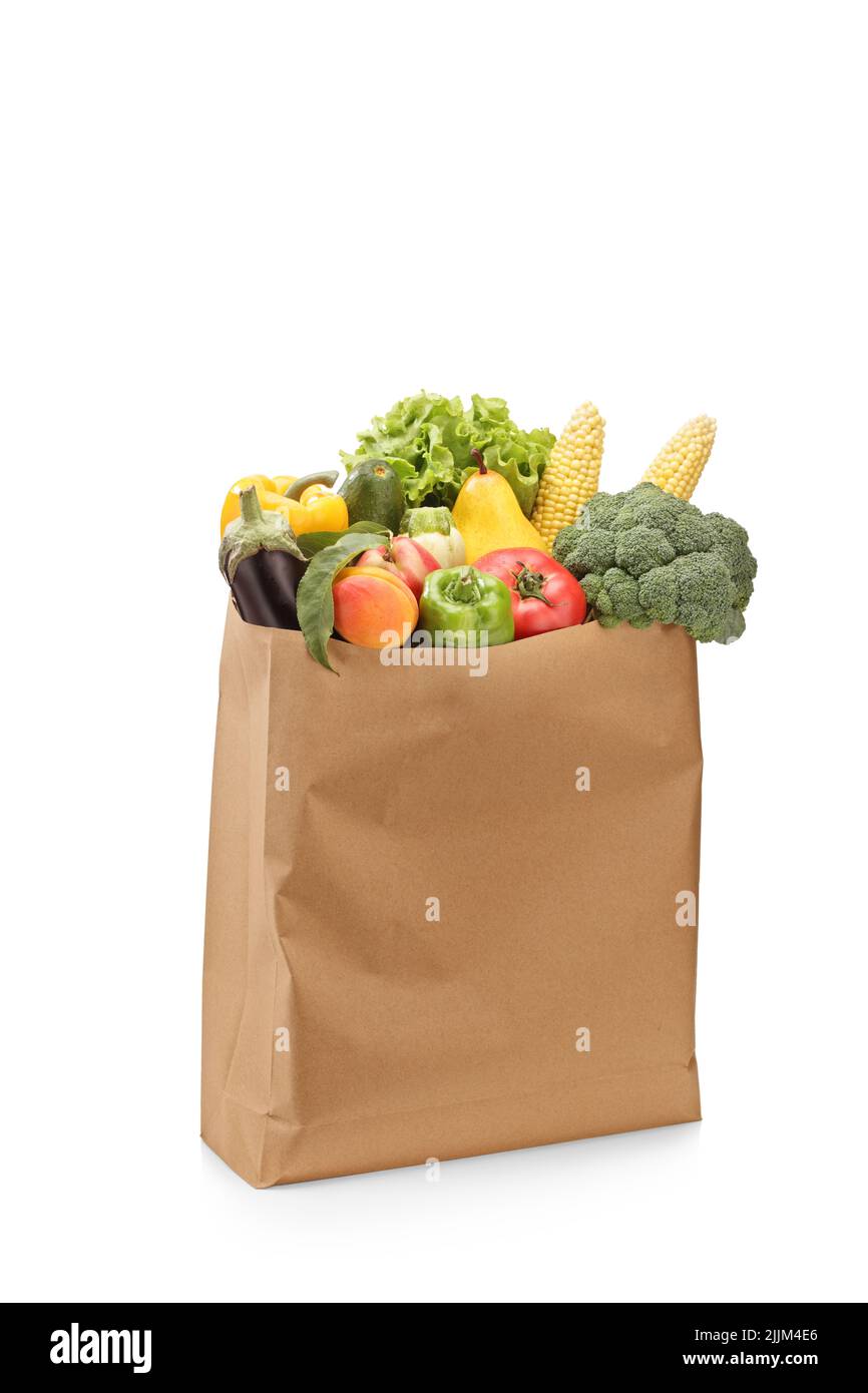 Studio shot of fresh organic fruits and vegetables in a paper bag ...