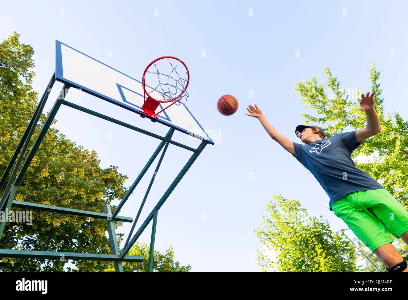 boy playing basketball outdoor Stock Photo