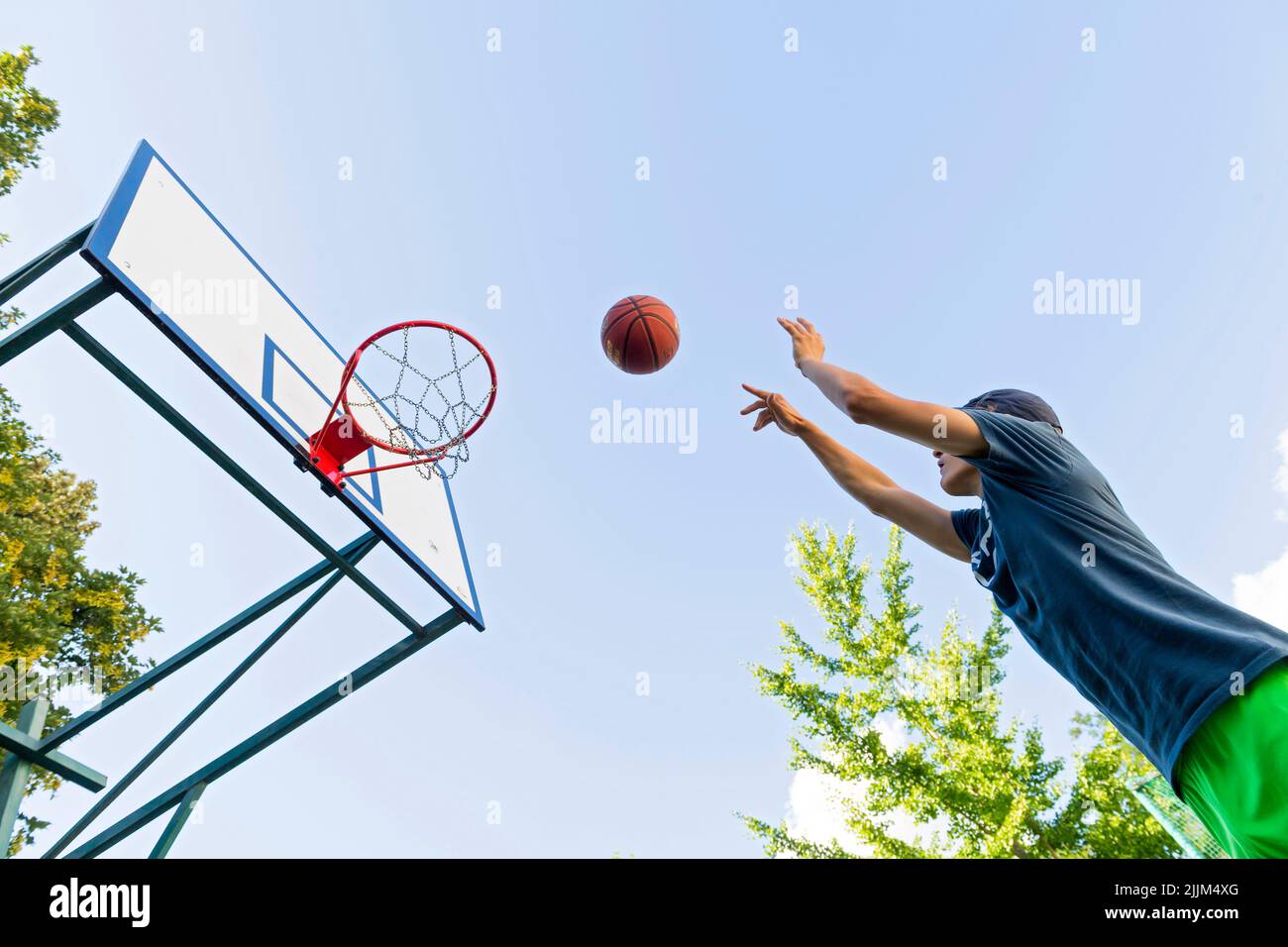 boy playing basketball outdoor Stock Photo