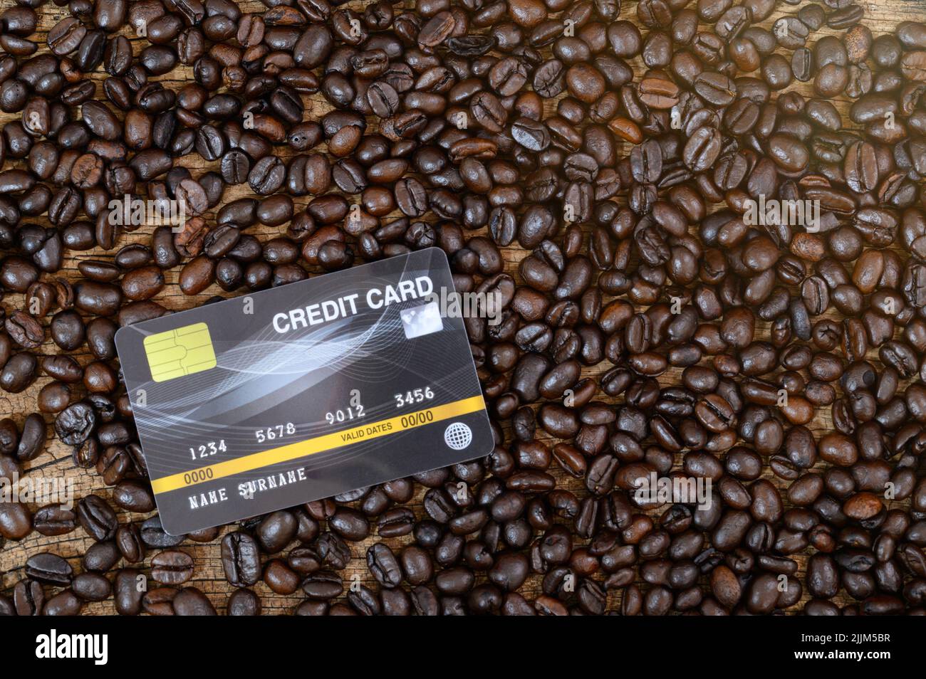 A photo of a credit card placed on coffee beans Stock Photo Alamy