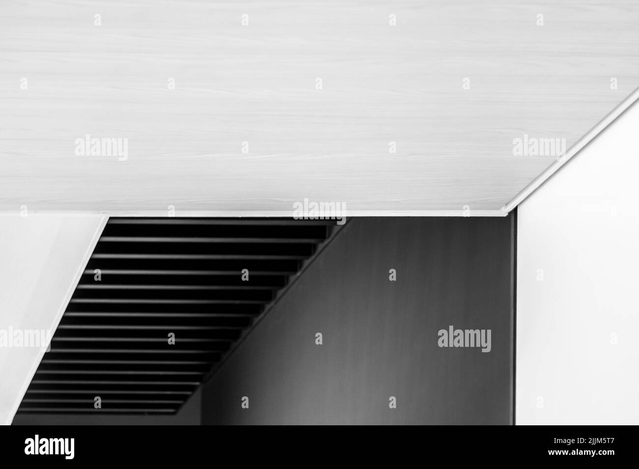 An abstract architecturally design stairs in grayscale Stock Photo