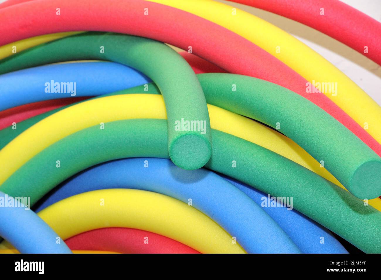 A closeup of colorful Polyethylene Cylinders Stock Photo