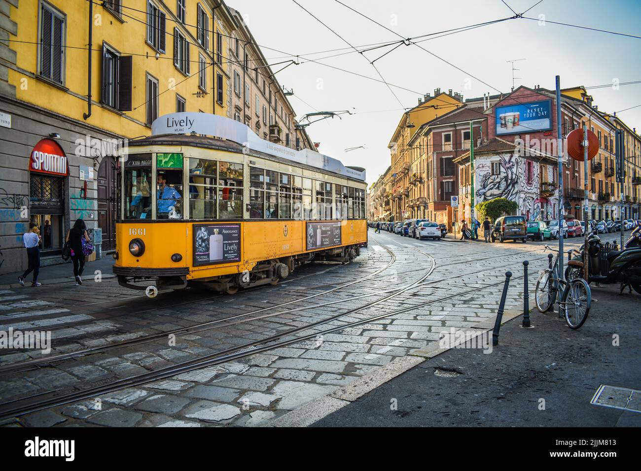The local transport in Viale Gorizia street near Navigli in Milan, Italy Stock Photo