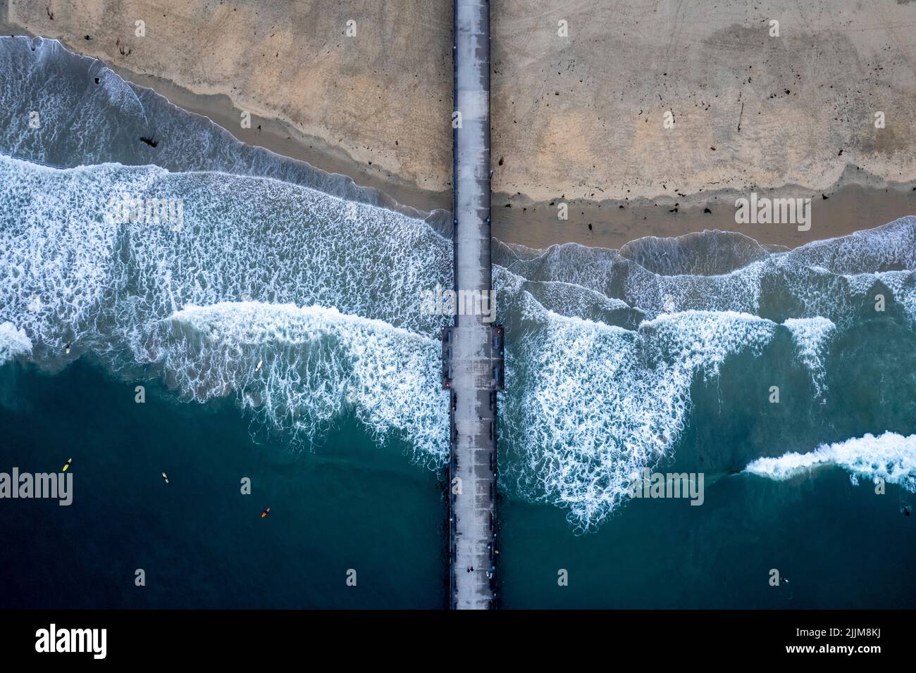 A top view of a beach pier under the cloudy skies Stock Photo - Alamy