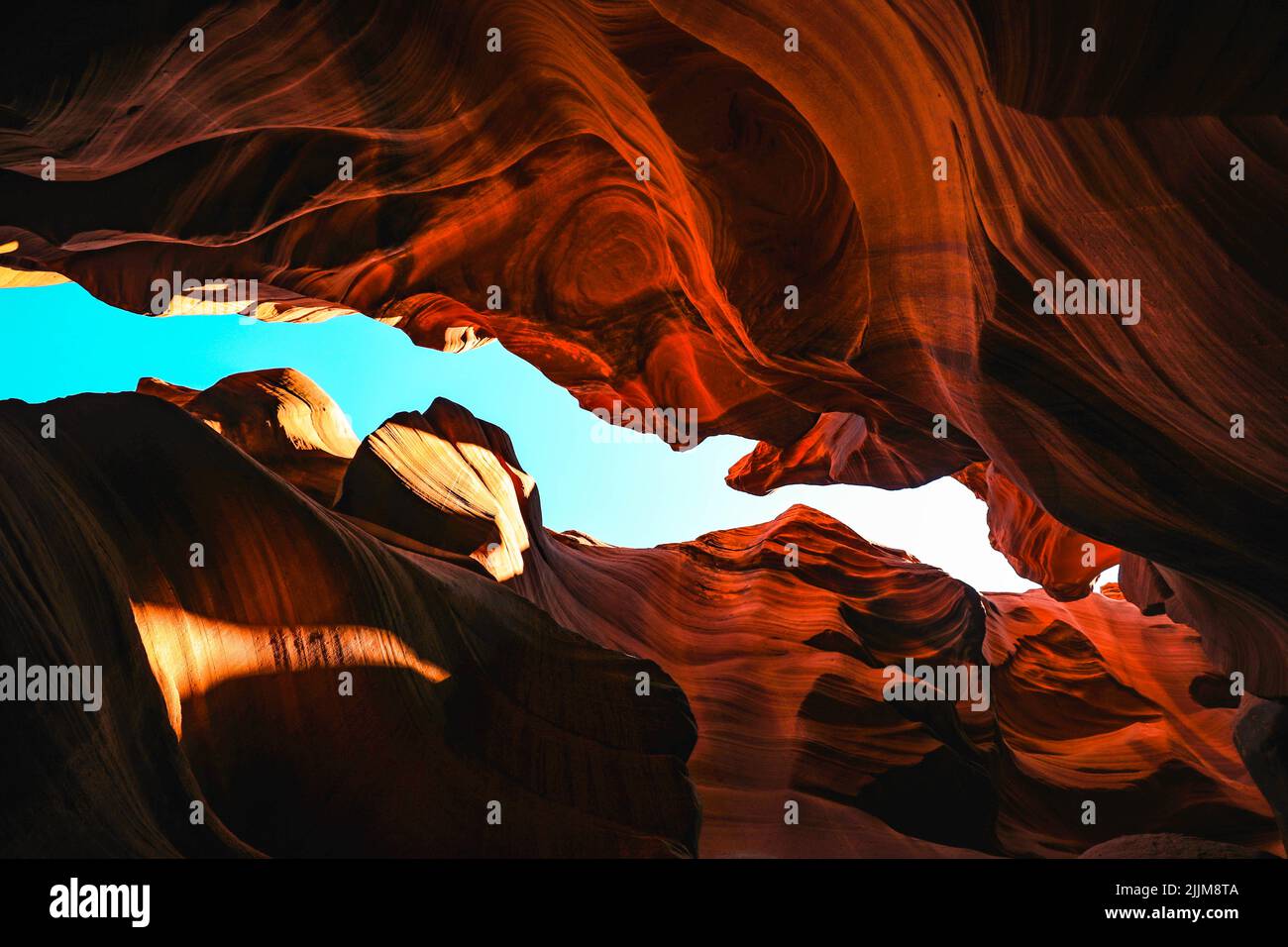 A low angle shot of Antelope Canyon under a clear sky in Lechee, Arizona Stock Photo