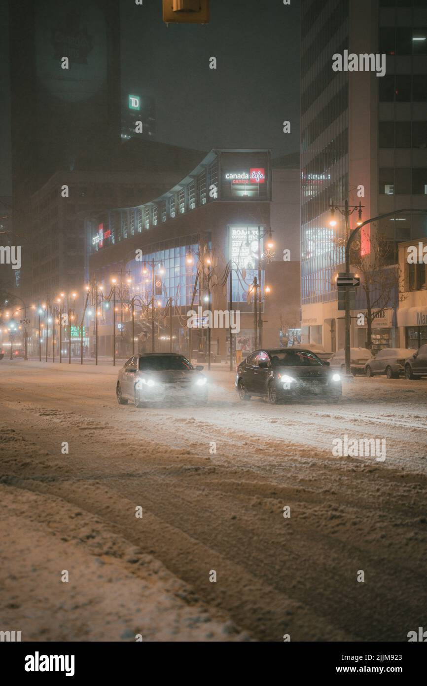 The cars on a snowy city street Stock Photo - Alamy