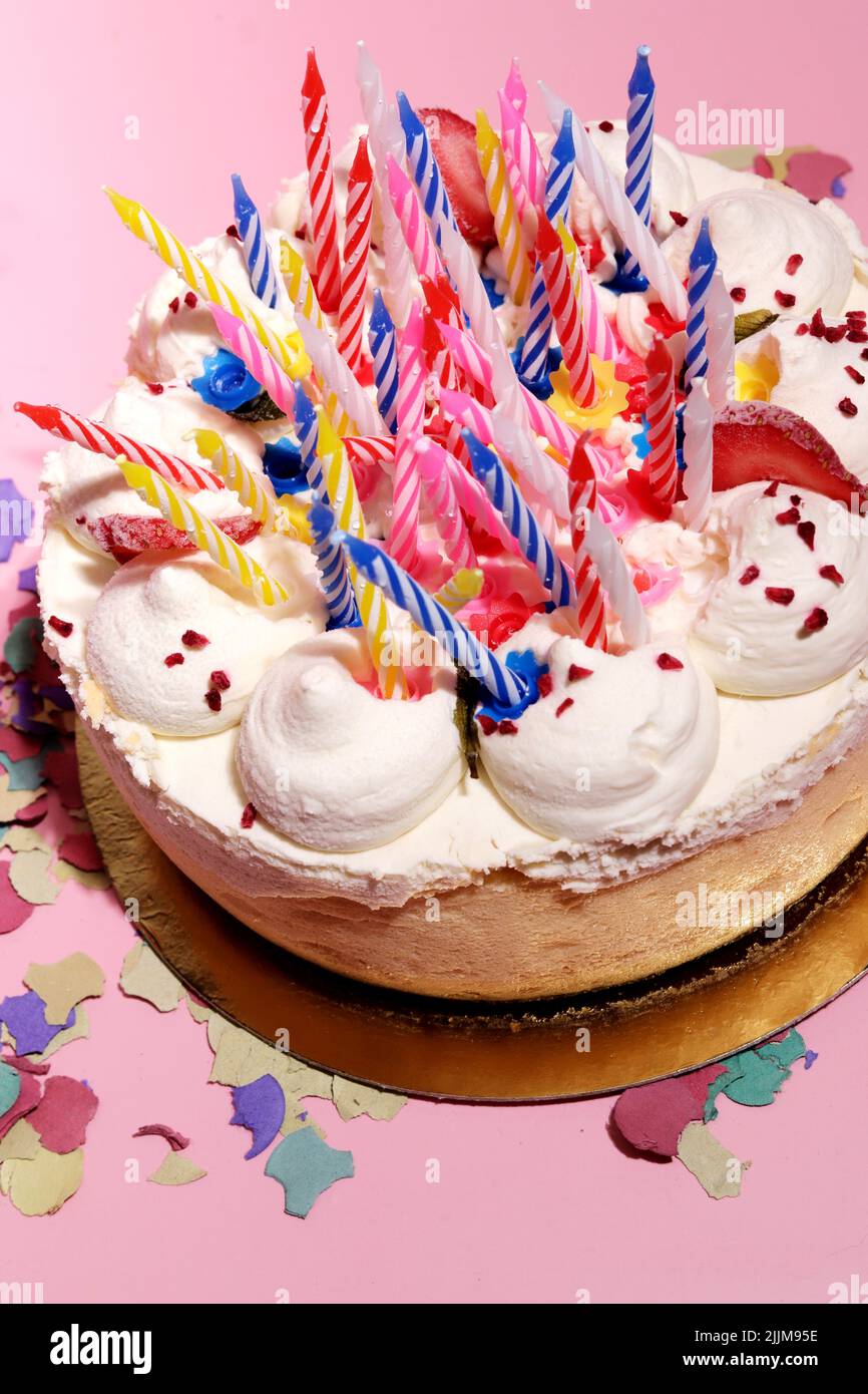 photo of many colorful birthday candles on a cake Stock Photo Alamy