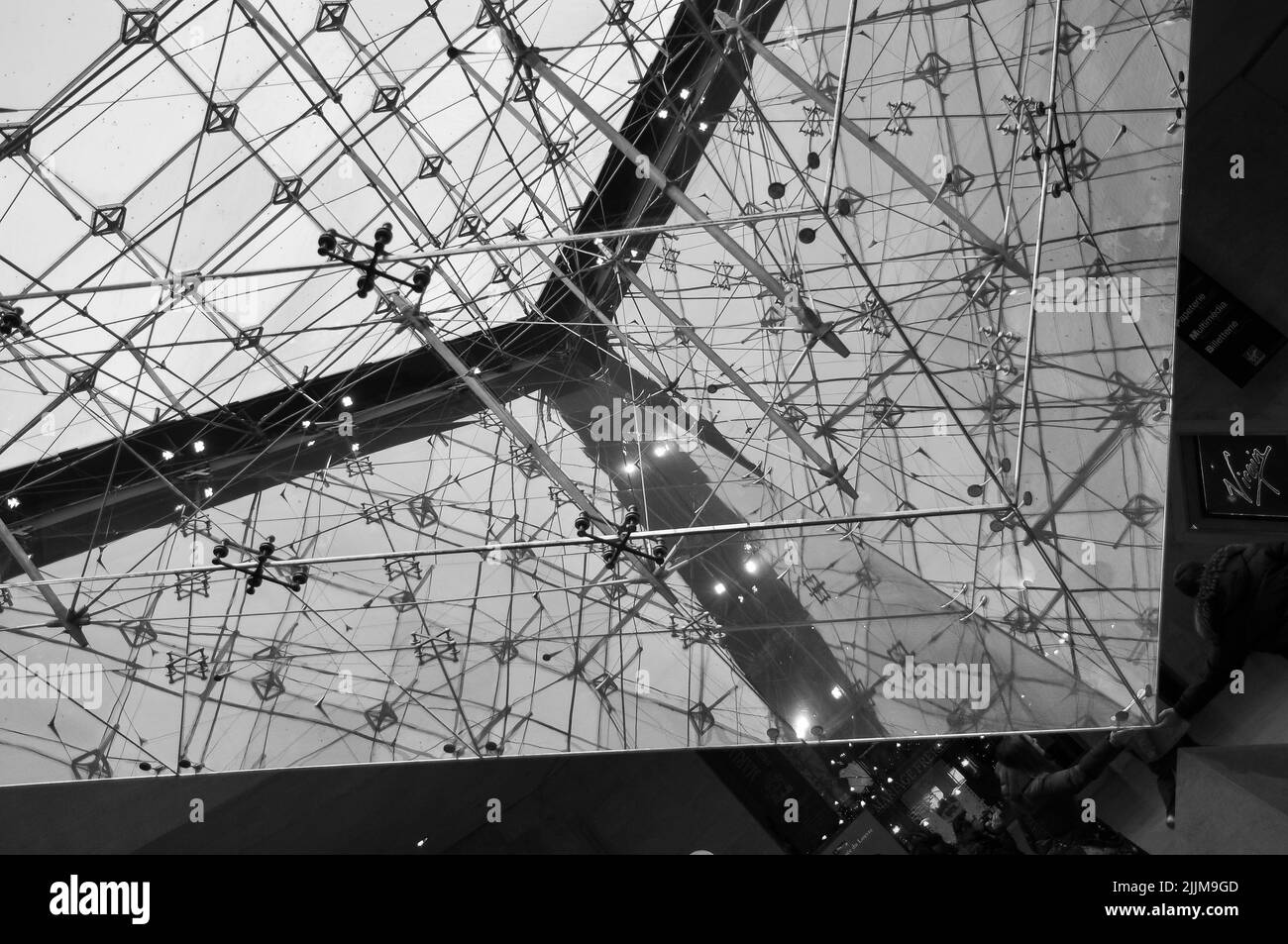 A low angle of the ceiling inside Louver Museum in Paris, France during