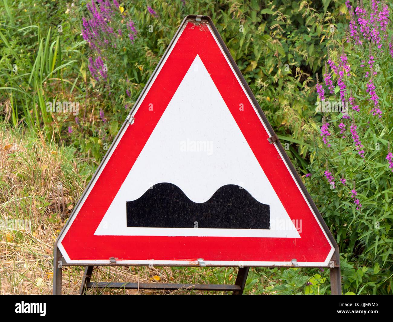Here is the humble UK road sign warning of a humpback bridge, a butt of much ribald and politically incorrect humour - all because it reminds some uns Stock Photo