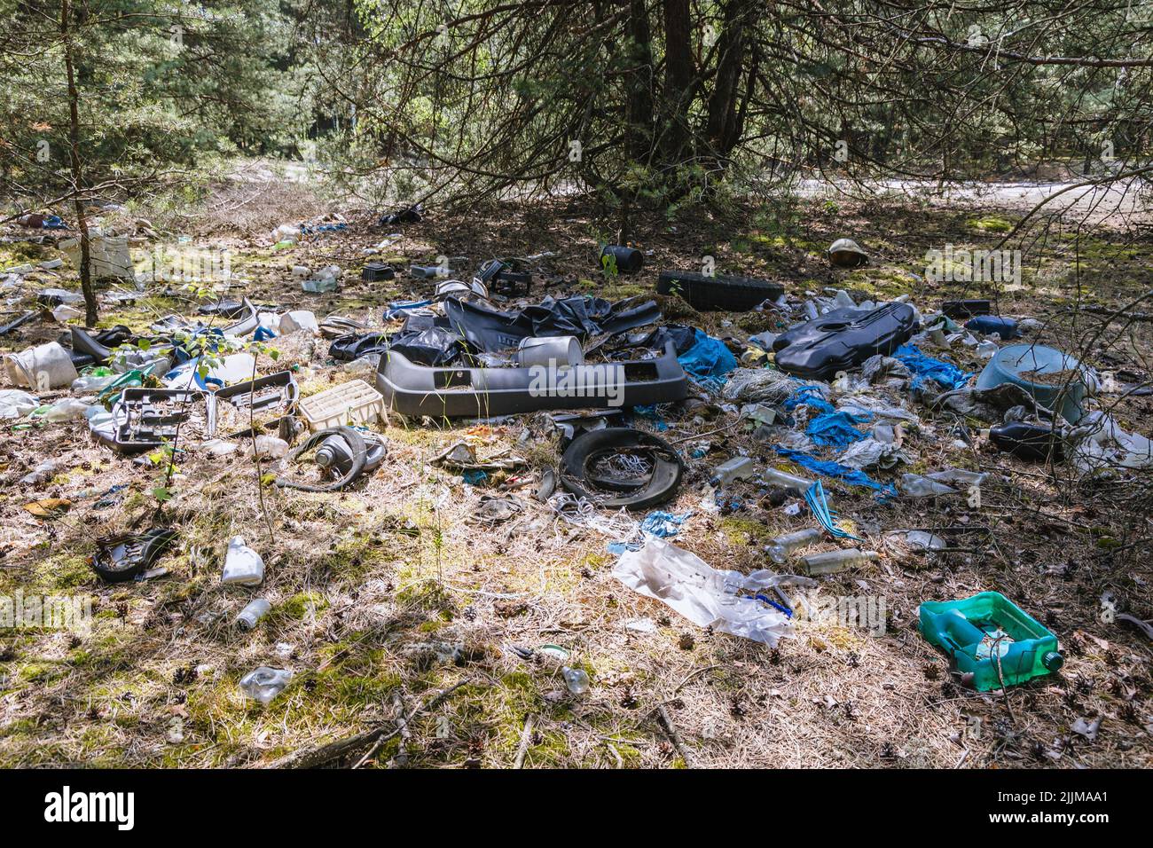 Illegal trash dump in forest in Wegrow County, Mazovian Voivodeship of Poland Stock Photo