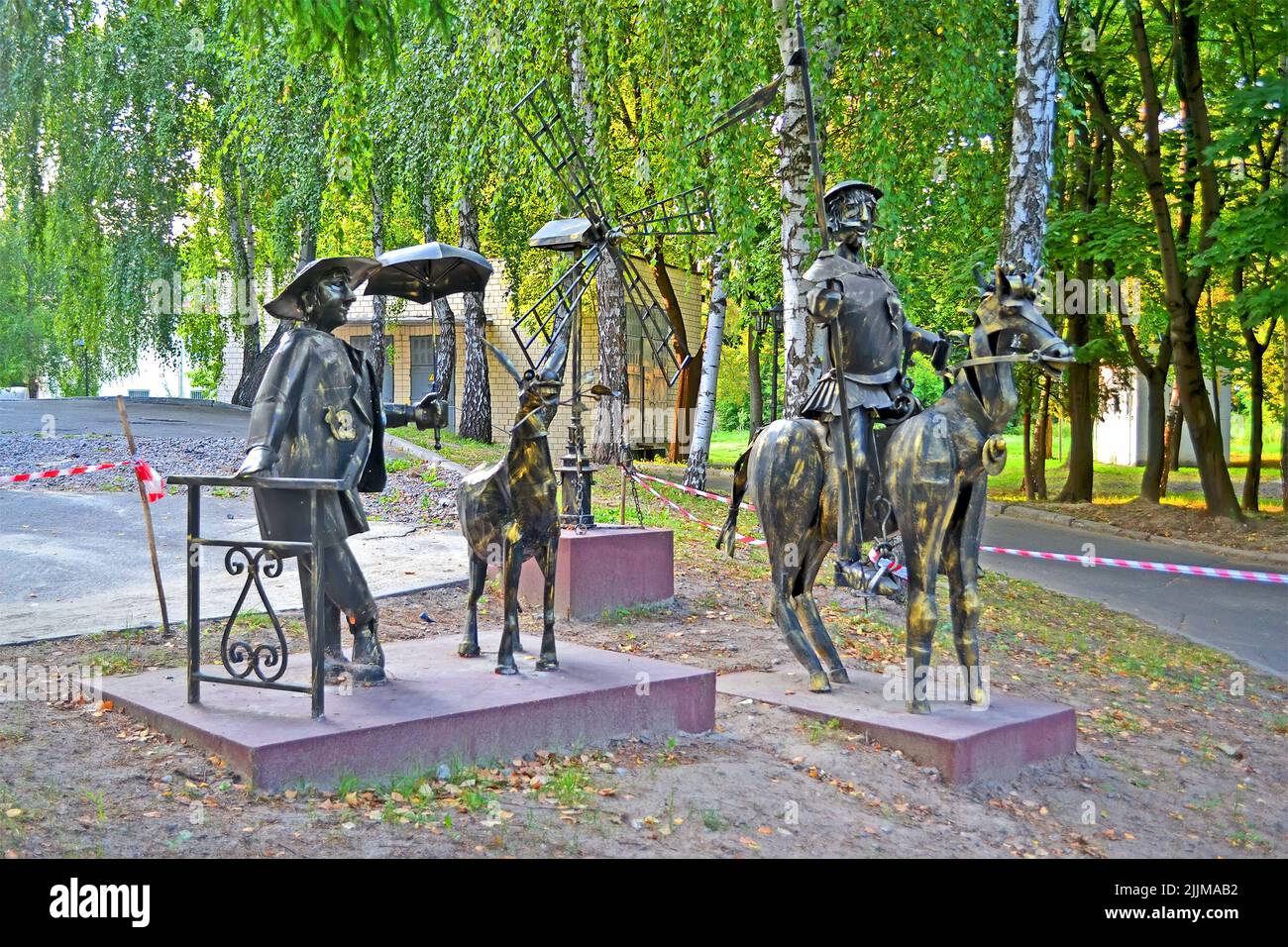 forged metal men statue Don Quixote; his horse Rocinante and his squire Sancho Panza by Miguel de Cervantes in the Kyiv City Psychiatric Hospital N1. Stock Photo