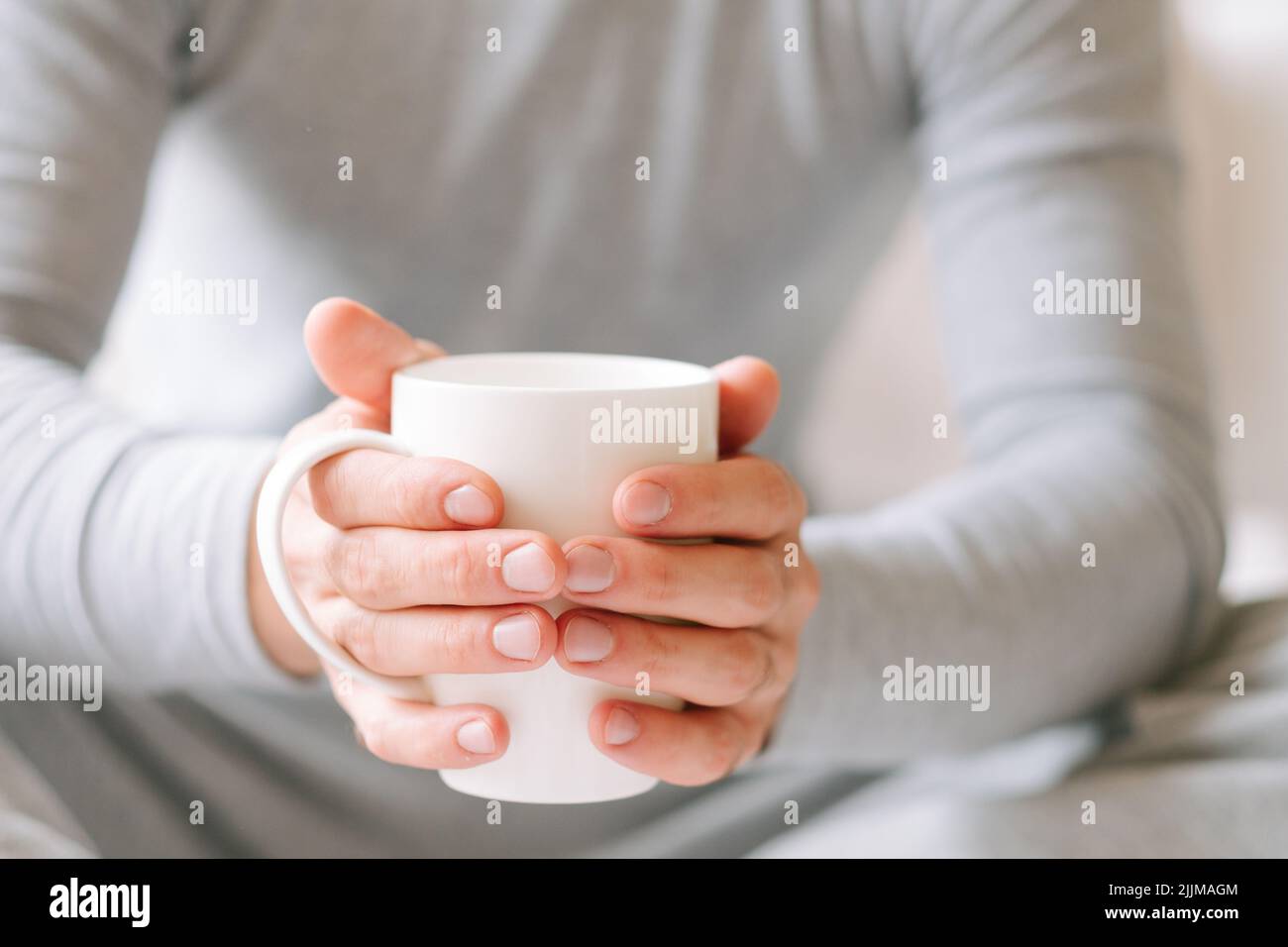 morning tea beverage man sit hold cup Stock Photo
