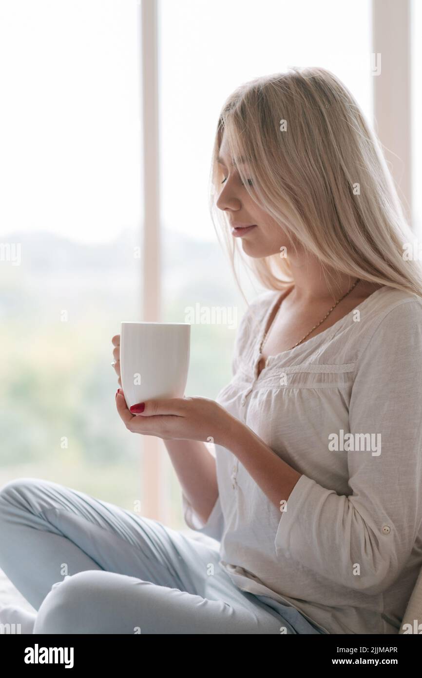 favourite drink morning ritual woman hold cup Stock Photo