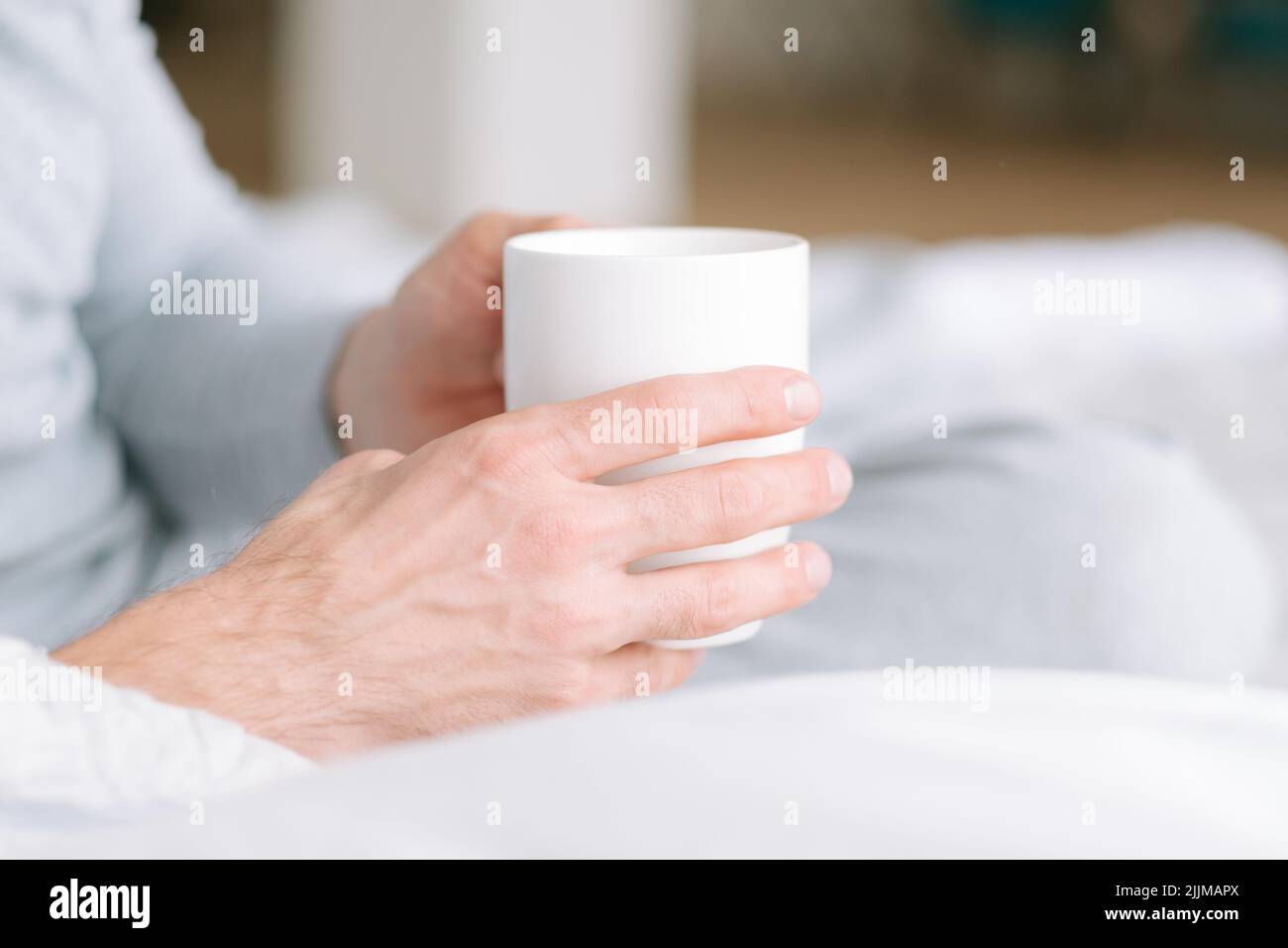 comfort healthy morning drink man hold cup Stock Photo