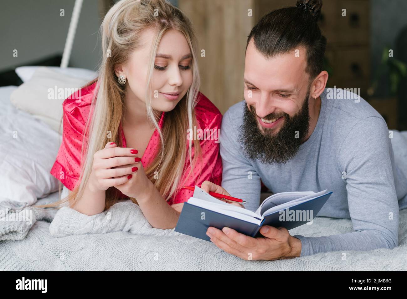 family morning vacation planning man woman notes Stock Photo
