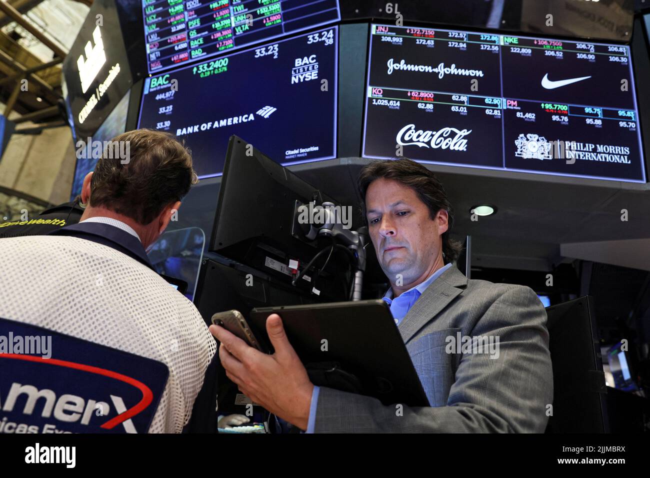 Traders work on the floor of the New York Stock Exchange (NYSE) in New York City, U.S., July 27, 2022.  REUTERS/Brendan McDermid Stock Photo