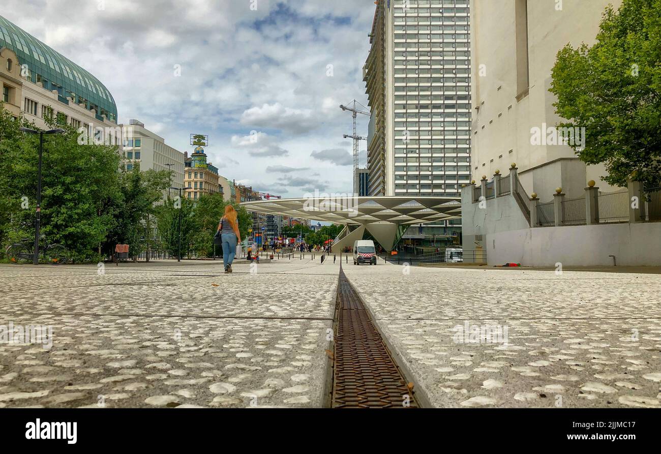 Brussels, Belgium, 08 June 2022, Empty square floor and modern city skyline with buildings in Brussels at noon. High quality photo Stock Photo