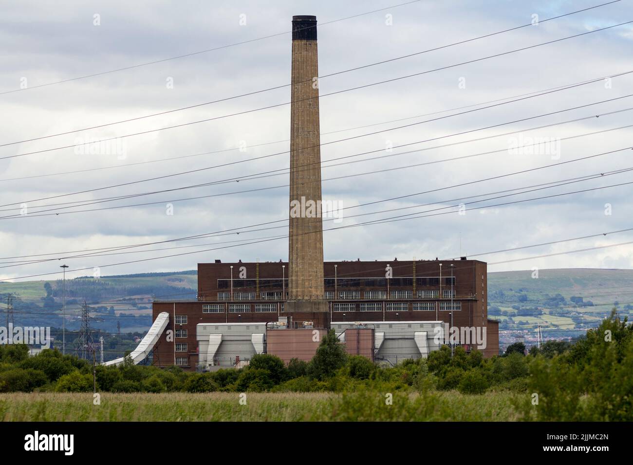 Industrial landscape in part of rspb newport south wales nature reserve, mixing river usk severn estuary wetland etc with commercial landscape views Stock Photo