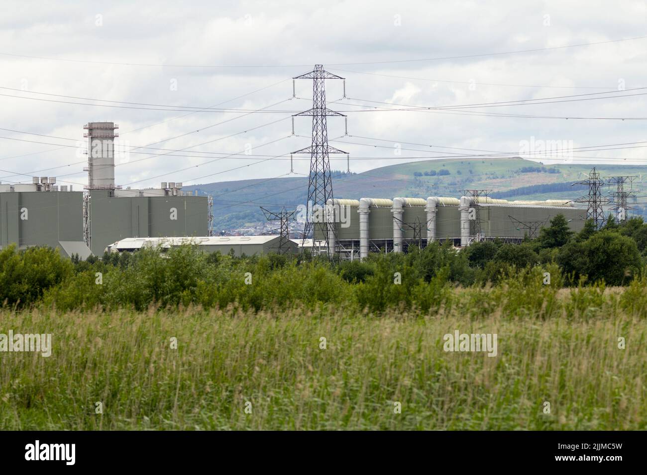 Industrial landscape in part of rspb newport south wales nature reserve, mixing river usk severn estuary wetland etc with commercial landscape views Stock Photo