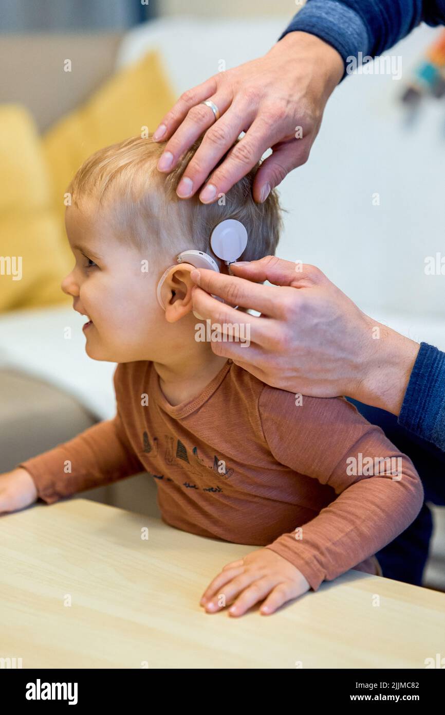 A shot of a deaf child with cochlear implants Stock Photo