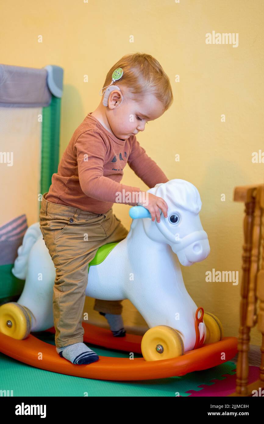 A shot of a deaf baby playing Stock Photo