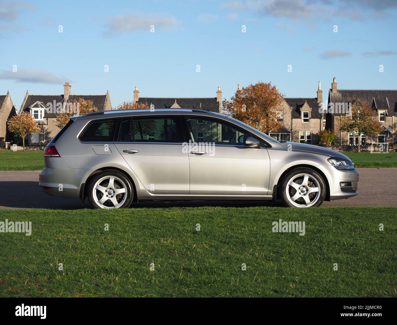 Tungsten silver Volkswagen Golf MK7 estate, variant, Team Dynamics Pro Race  3 Alloys. Trees with leaves in full autumnal colours & an old stone wall  Stock Photo - Alamy