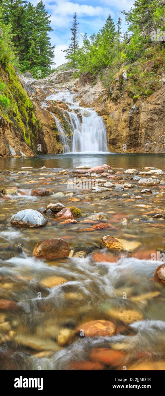 vertical panorama of smith creek falls in lewis and clark national forest near augusta, montana Stock Photo