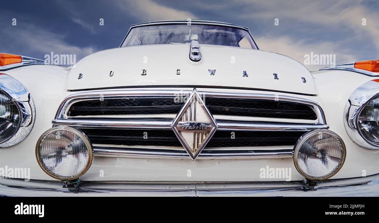 Helmstedt, Germany, July 17, 2022: Borgward Isabella, front end of German classic car from 1950s with chrome grille and fog lights Stock Photo