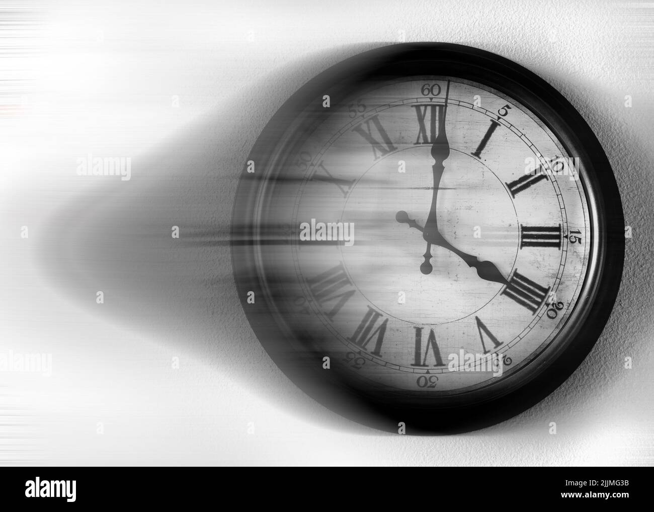 Old vintage clock with blurred motion speed speeding through time Stock Photo