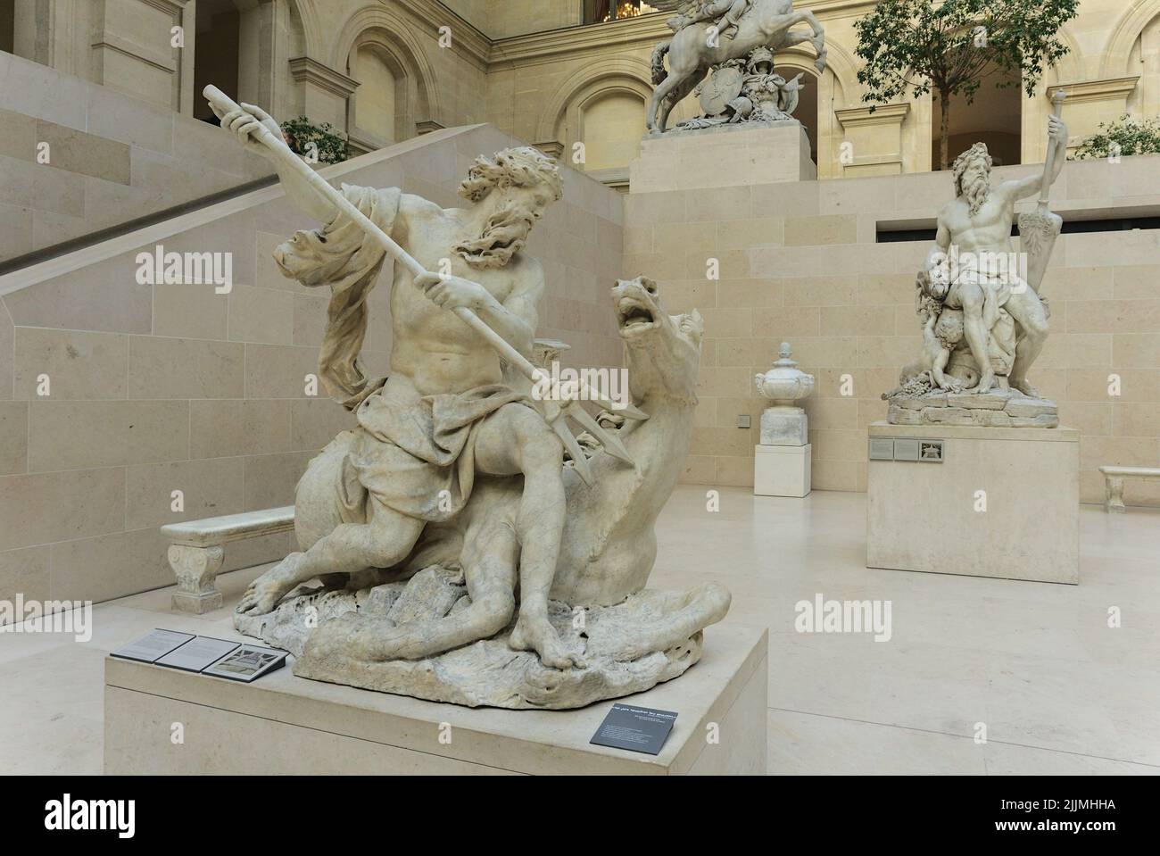 A closeup of the Marble sculpture Neptune in Richelieu Wing of Louvre