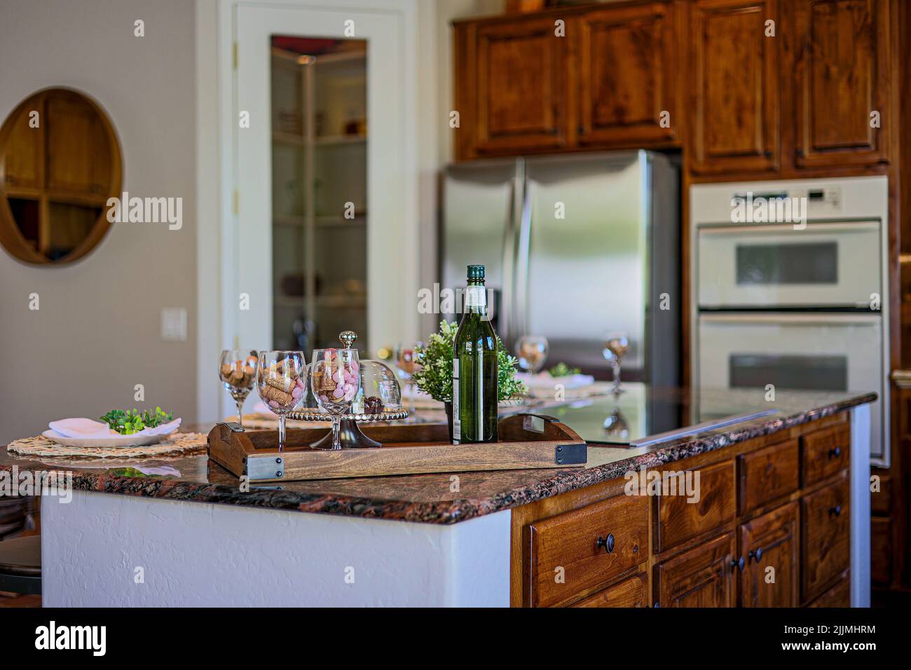 A beautiful interior design of a kitchen with a set dining table Stock