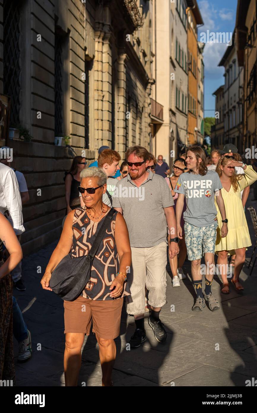 Cortona, Italy - July 15, 2022: people on the street in the small Tuscan town, home to the international photography festival 'Cortona on the move'. Stock Photo