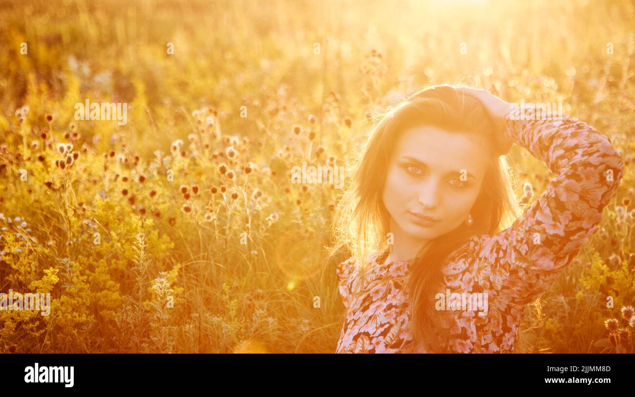 girl in the field in the sun Stock Photo - Alamy