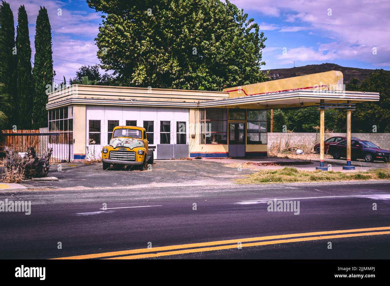 A beautiful view of Lost Gas Station in Mojave Desert, Nevada, United States with trees and a blue sky Stock Photo