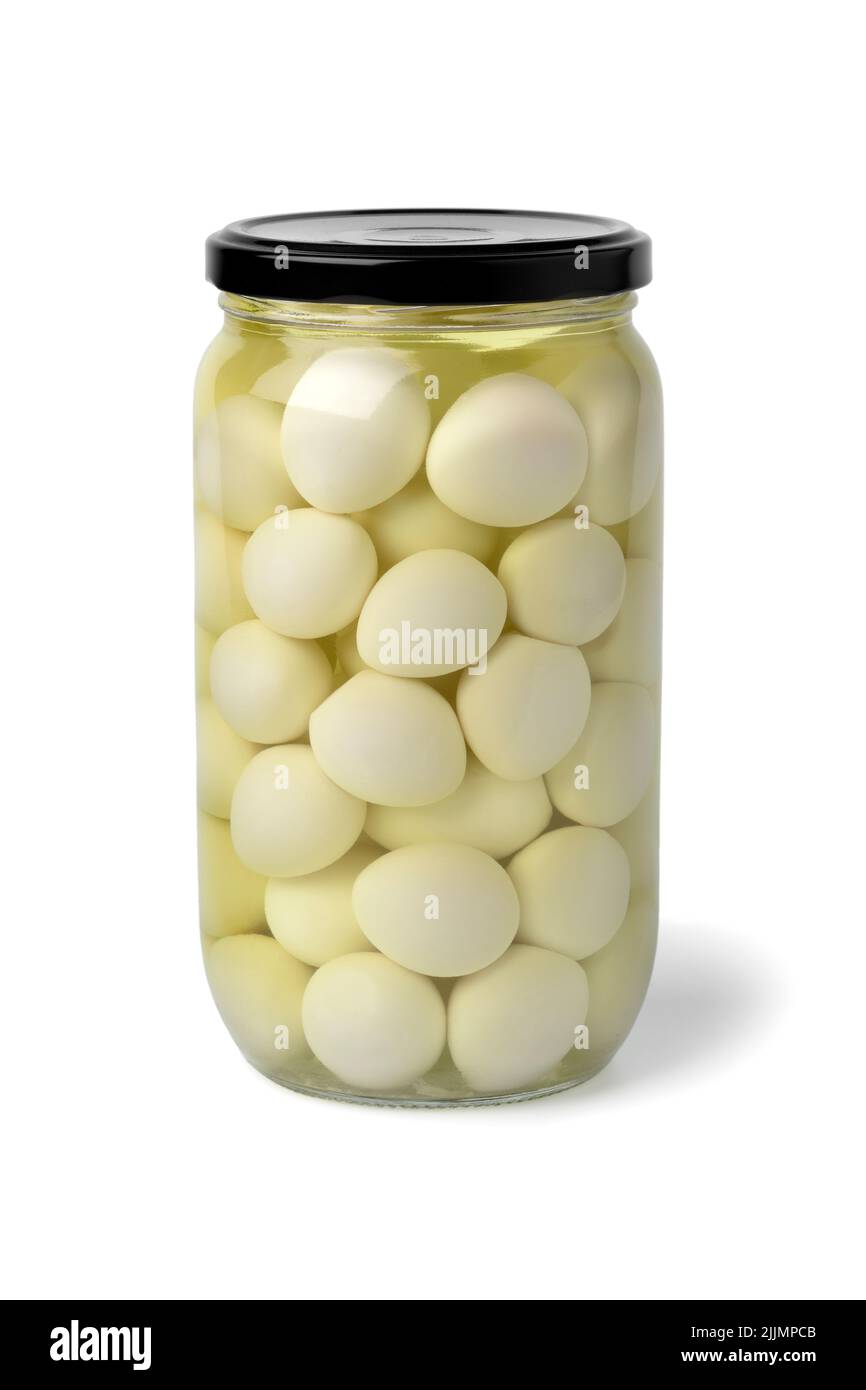 Glass jar with preserved cooked Quail eggs i water close up isolated on white background Stock Photo