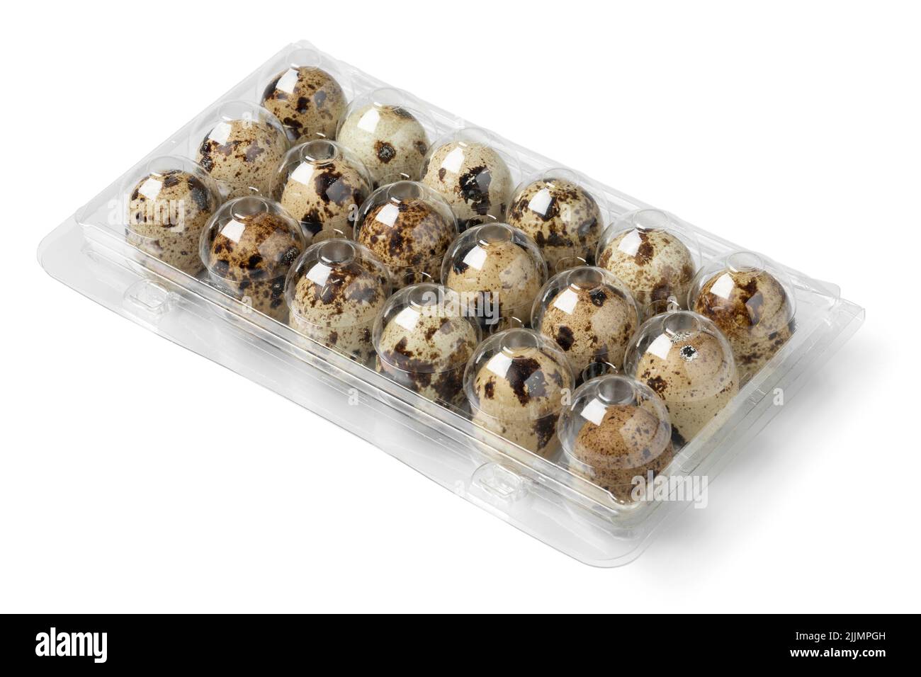 Plastic box with raw Quail eggs close up isolated on white background Stock Photo