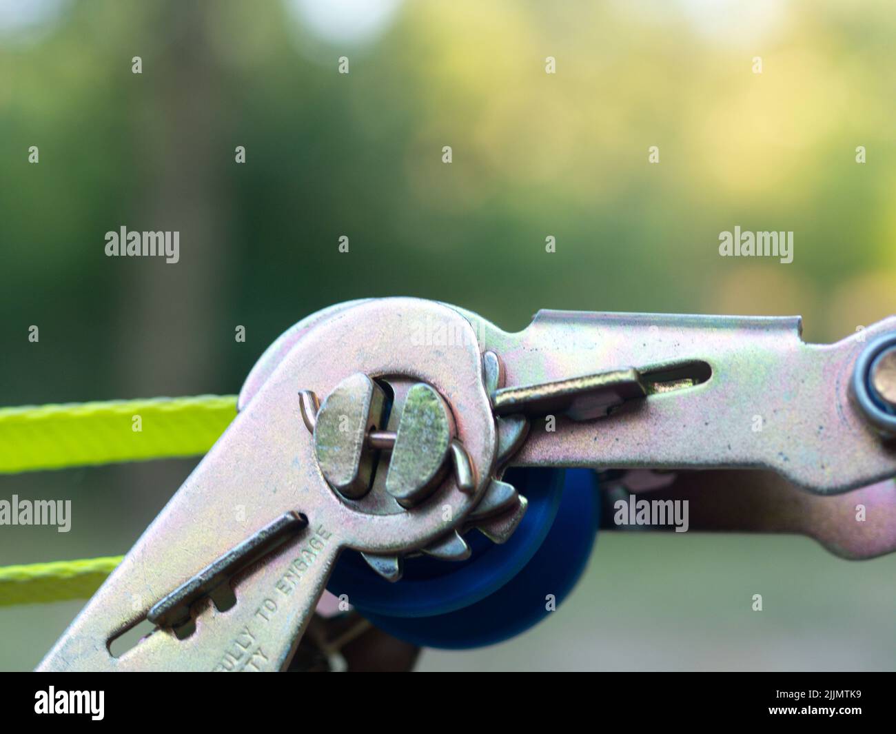 Mindfulness Slackliner Man Crossing a Tightrope in a park during a ...