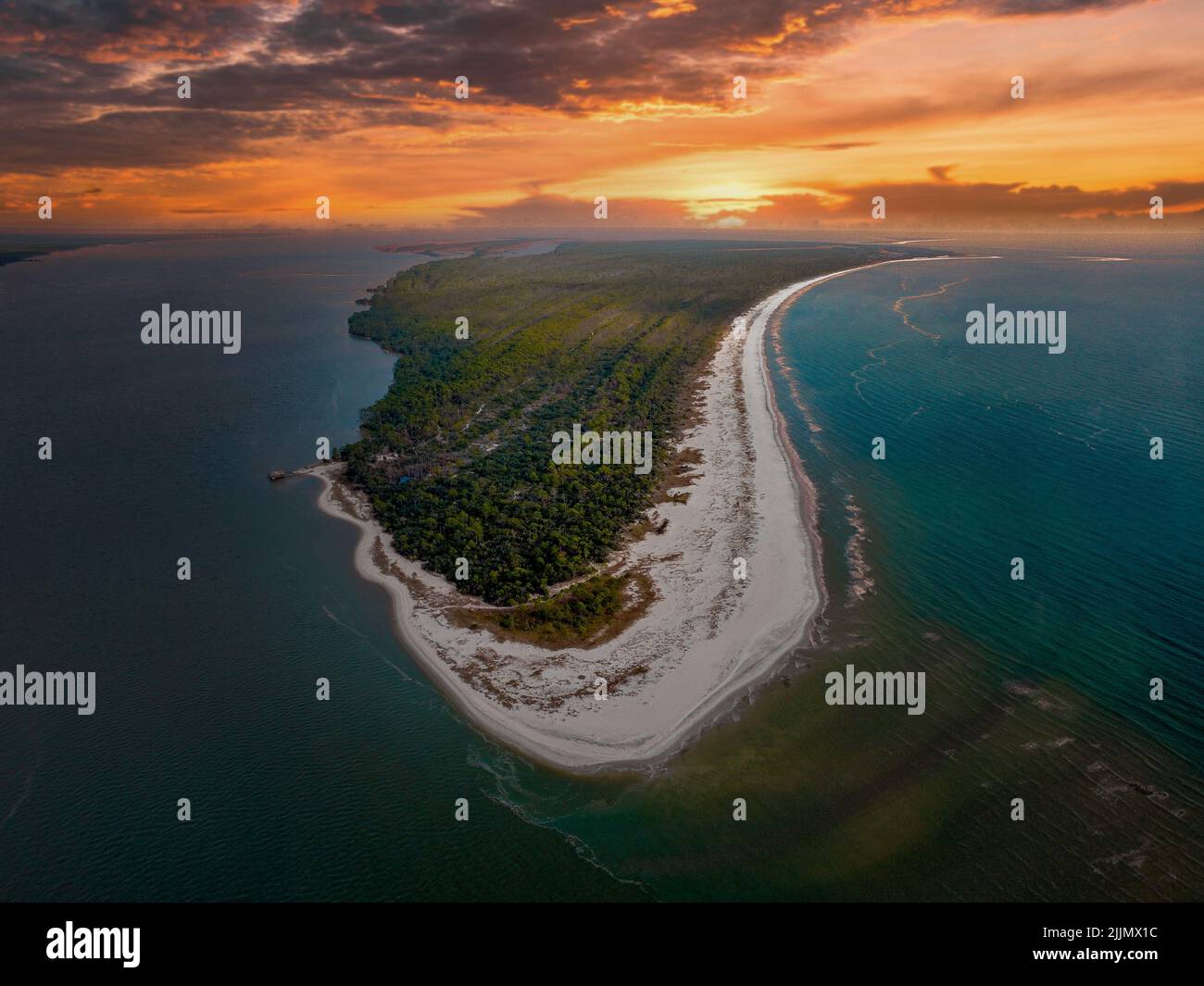 a photo of an green island in ocean Stock Photo - Alamy