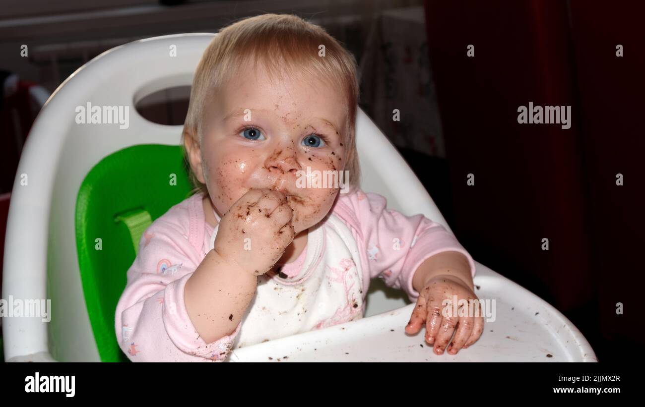 When sweet baby eat cookies Stock Photo