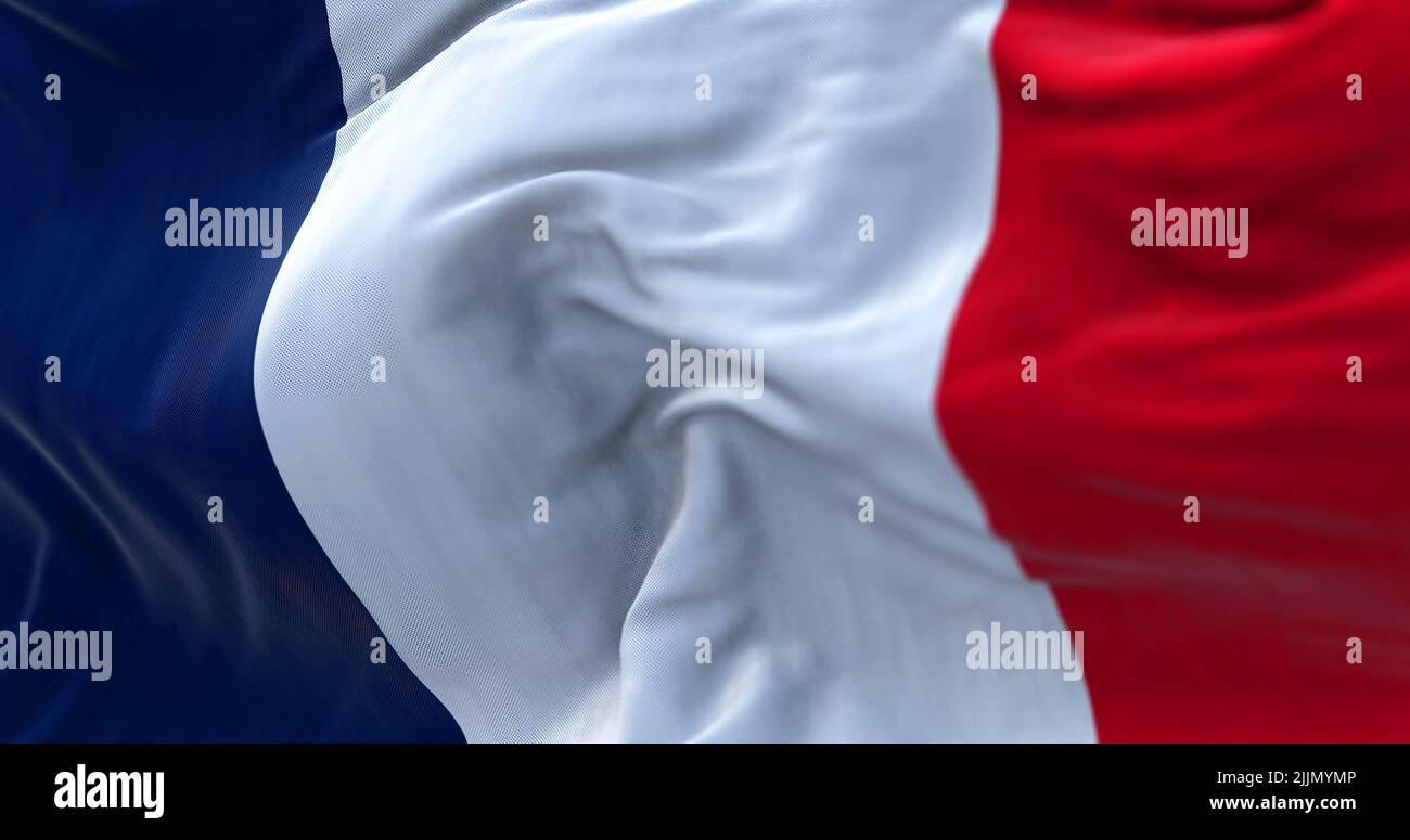 Close-up view of the France national flag waving in the wind. France is a country located in Western Europe. Fabric texture background. Selective focu Stock Photo