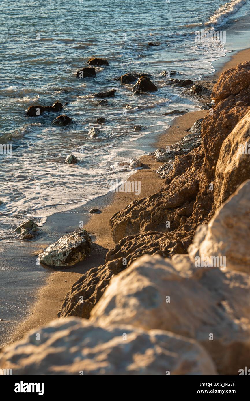 Rocky shore with sunset hi-res stock photography and images - Alamy