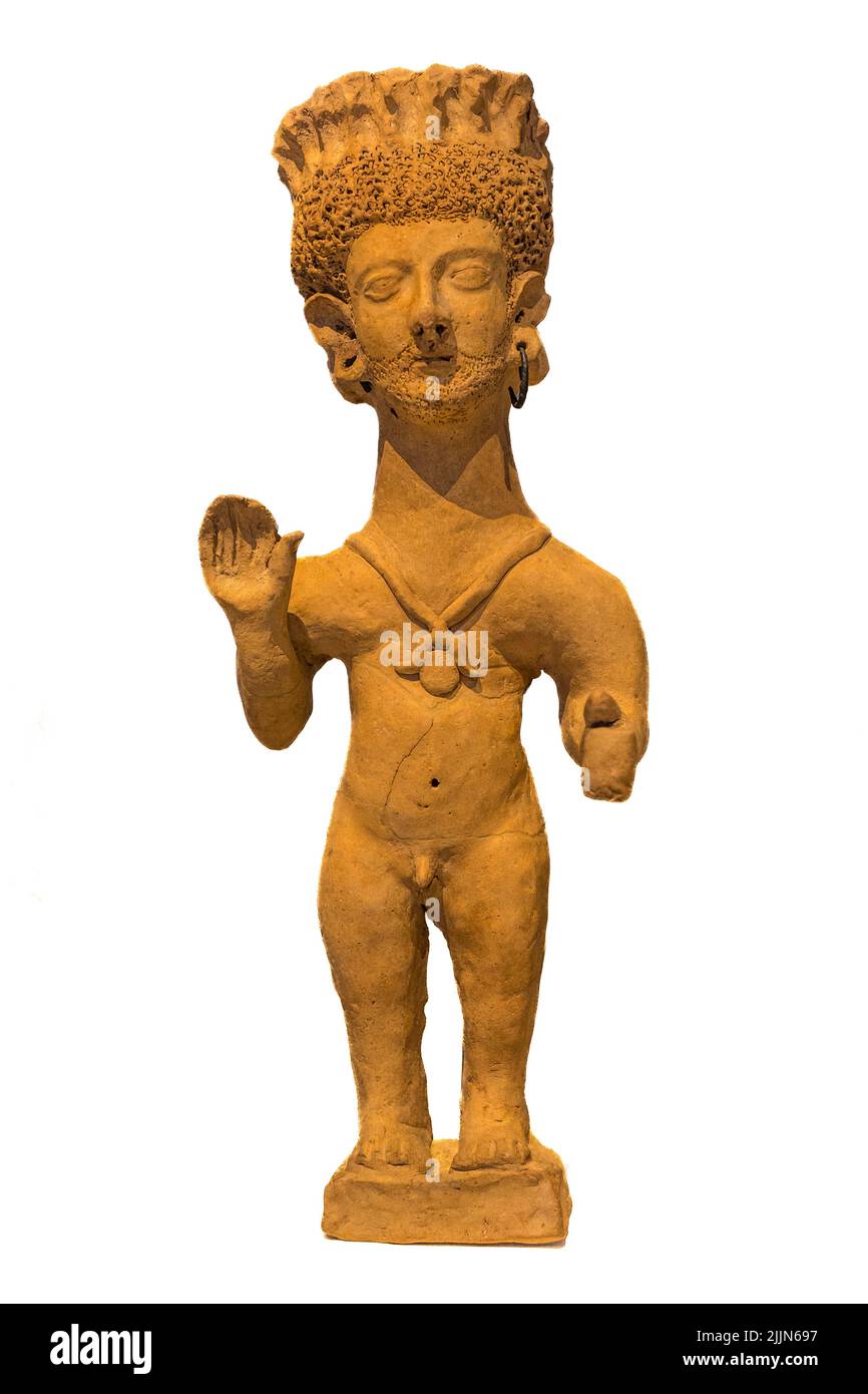 a 4th - 3rd century BC,  ceramic figure Identified as a Punic Deity, or offerant, Found at the Necropolis of Puig des Molins, Ibiza, Punic. Spain. Now Stock Photo