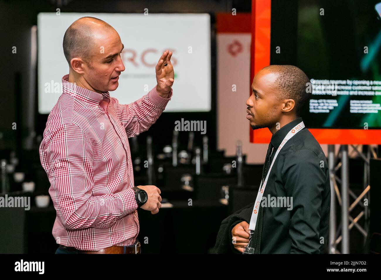 The vendors demonstrating a product service at a retail industry conference in Johannesburg,South Africa Stock Photo