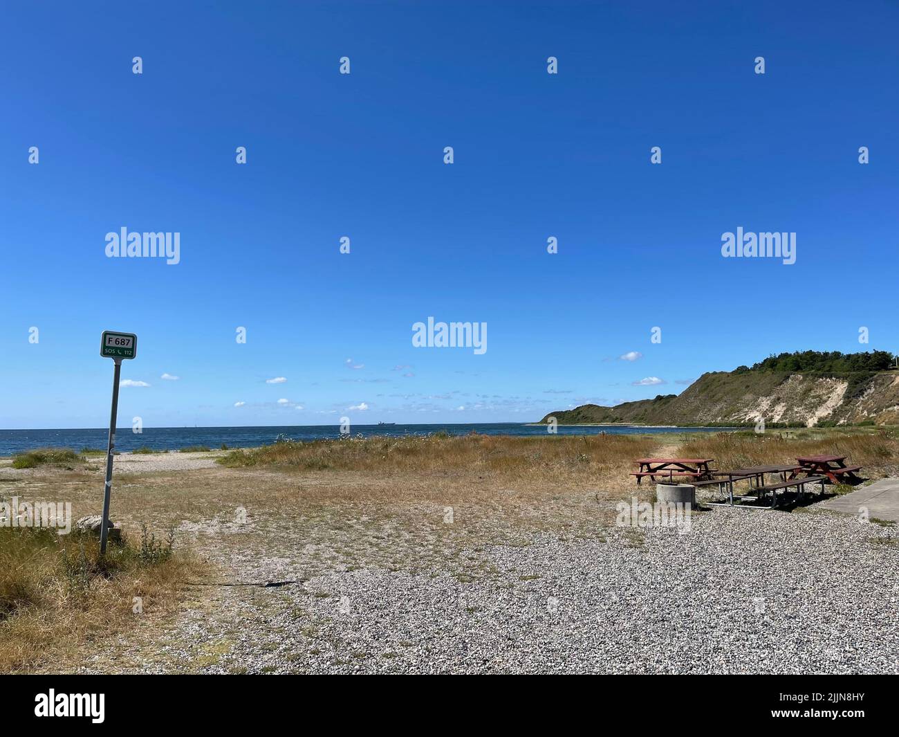 Empty beach with Maarup Bakker in the distance, Maarup Havn, Samsoe, Jutland, Denmark Stock Photo