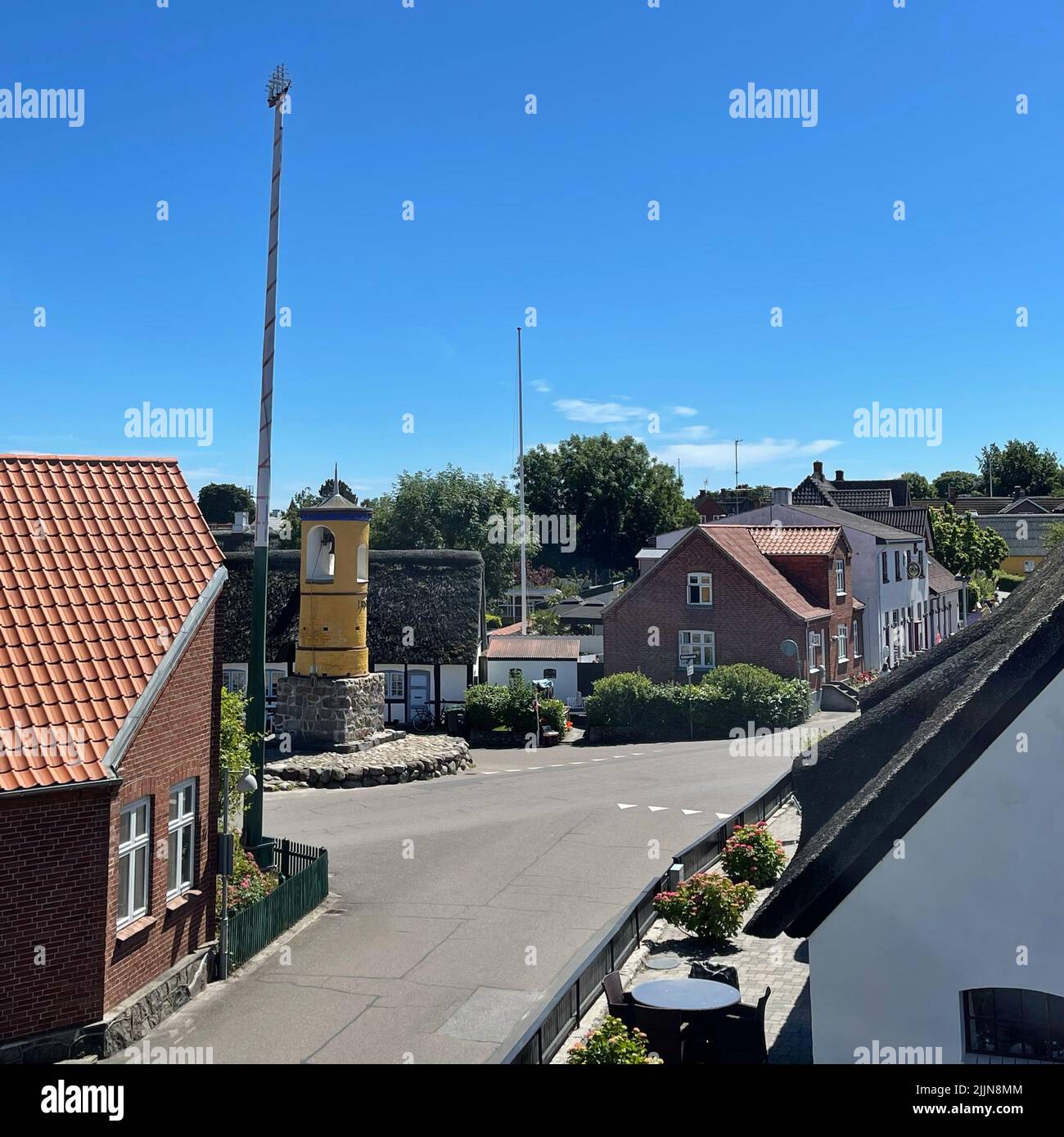 Villagescape with bell tower and maypole, Nordby, Samsoe, Jutland, Denmark Stock Photo